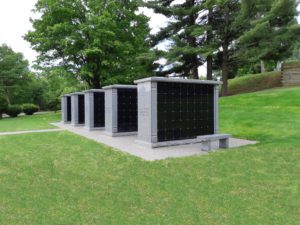 Rectangular 96 niche columbaria with added granite trim and sloped roofline